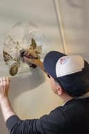 Artist Ozmo working at his artwork. Photo credits: Studio d'Arte Raffaelli